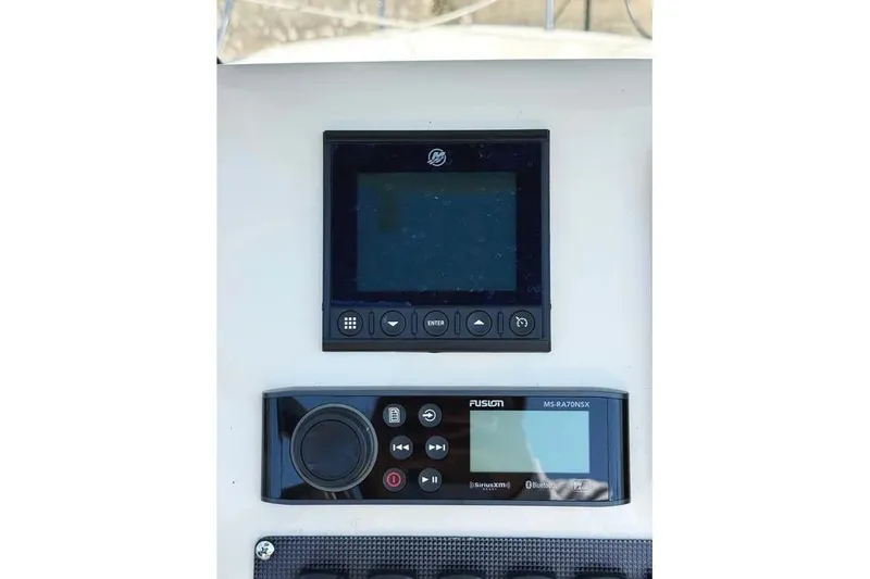 Slide: The Image of Control panel of 2022 Boston Whaler 220 Dauntless with navigation and audio systems. - 14