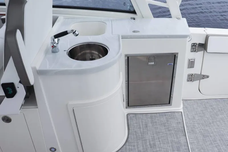 Slide: The Image of Manufacturer Provided Image: 2026 World Cat 325 DC boat interior with cushioned seating and ocean view. - 8