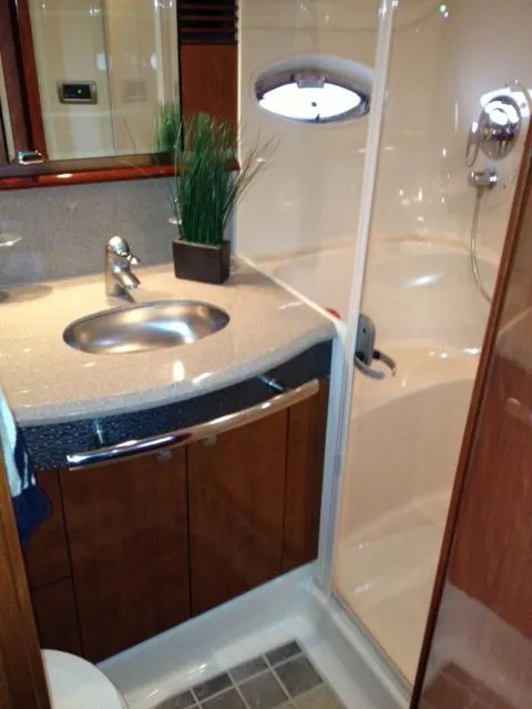Slide: The Image of Luxurious bathroom in 2004 Sea Ray 500 Sundancer yacht with modern fixtures and shower. - 10