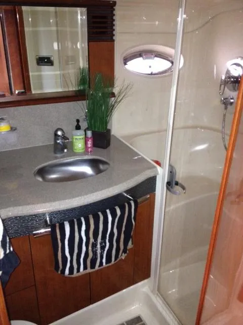 Slide: The Image of Luxurious bathroom in 2004 Sea Ray 500 Sundancer yacht with modern fixtures and shower. - 28