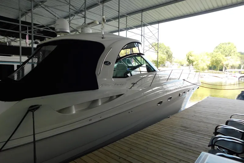 Slide: The Image of 2004 Sea Ray 500 Sundancer yacht docked in a covered marina. - 52