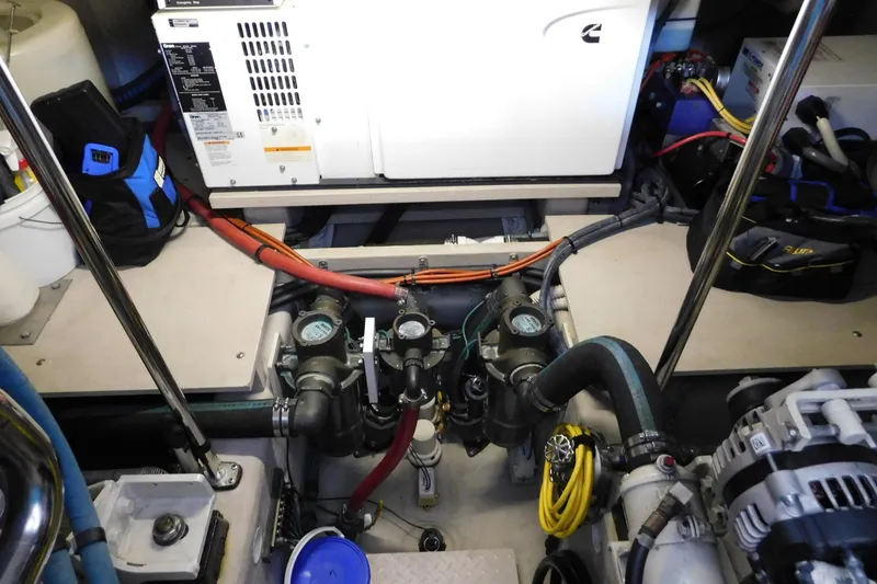 Slide: The Image of Engine room of a 2004 Sea Ray 500 Sundancer with visible machinery and equipment. - 57
