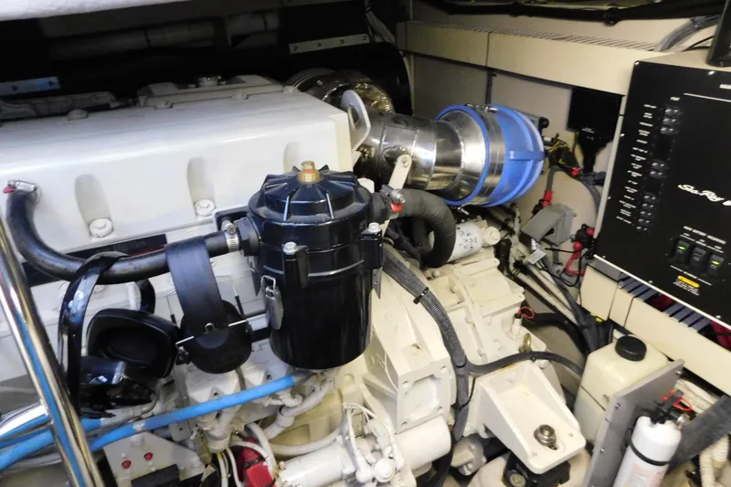 Slide: The Image of Engine room of 2004 Sea Ray 500 Sundancer yacht, showcasing mechanical components. - 59