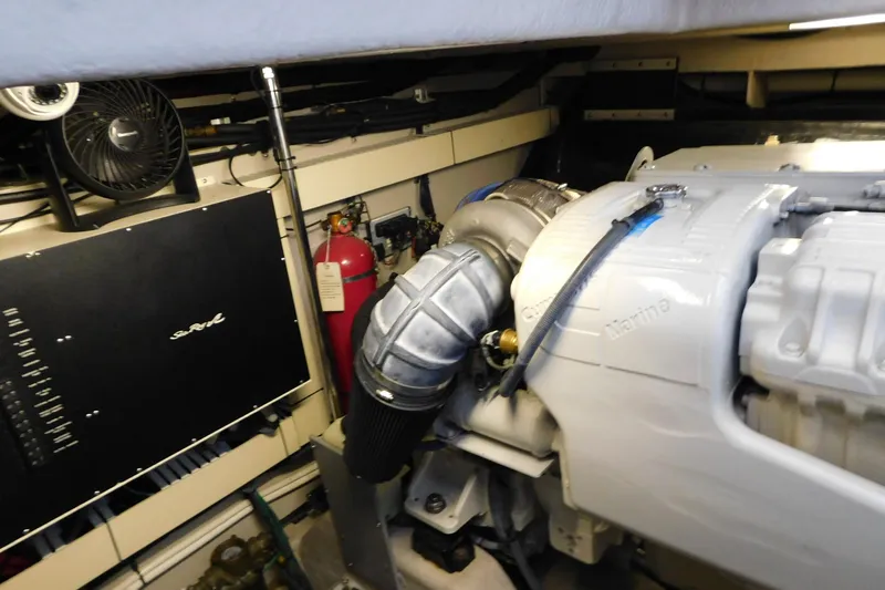 Slide: The Image of Engine room of 2004 Sea Ray 500 Sundancer with visible machinery and equipment. - 60