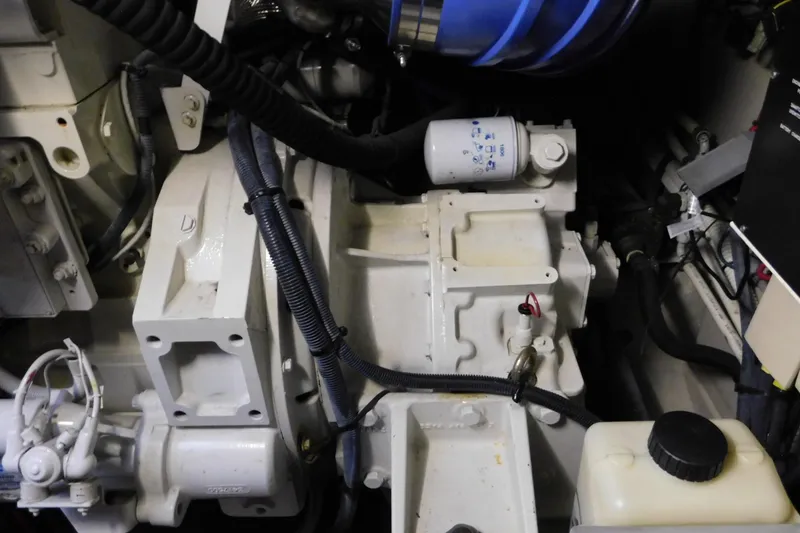 Slide: The Image of Engine compartment of a 2004 Sea Ray 500 Sundancer boat, showcasing mechanical components. - 64