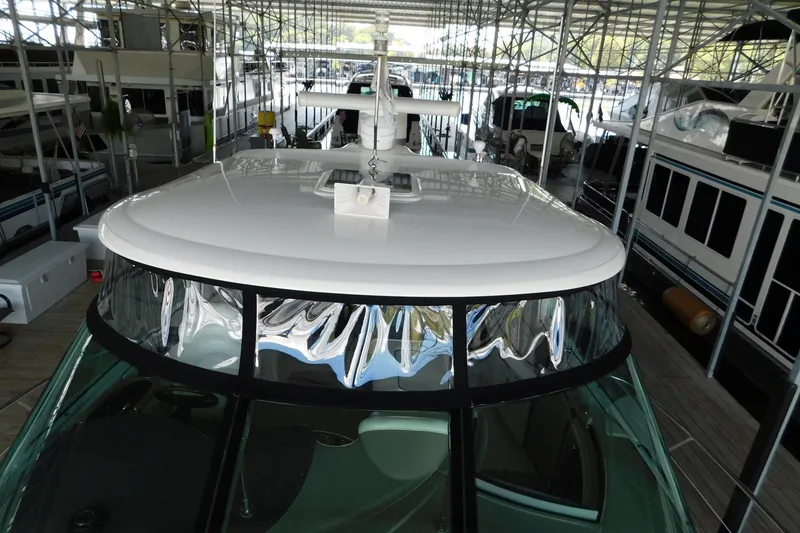 Slide: The Image of 2004 Sea Ray 500 Sundancer yacht docked in a marina, top view. - 70