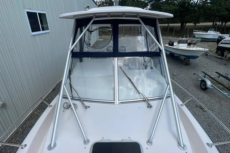 Slide: The Image of 2001 Grady-White Sailfish 255 boat with sturdy frame and clear windshield. - 18