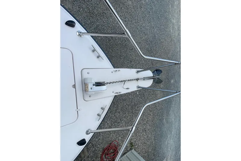 Slide: The Image of Bow of 2001 Grady-White Sailfish 255 with anchor and chain on gravel surface. - 19