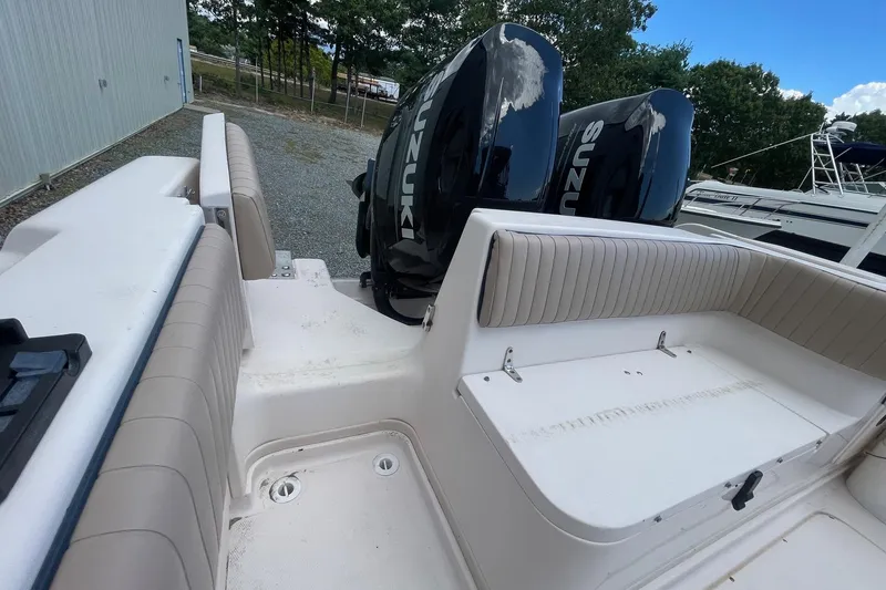 Slide: The Image of 2001 Grady-White Sailfish 255 boat interior with Suzuki outboard engines. - 22