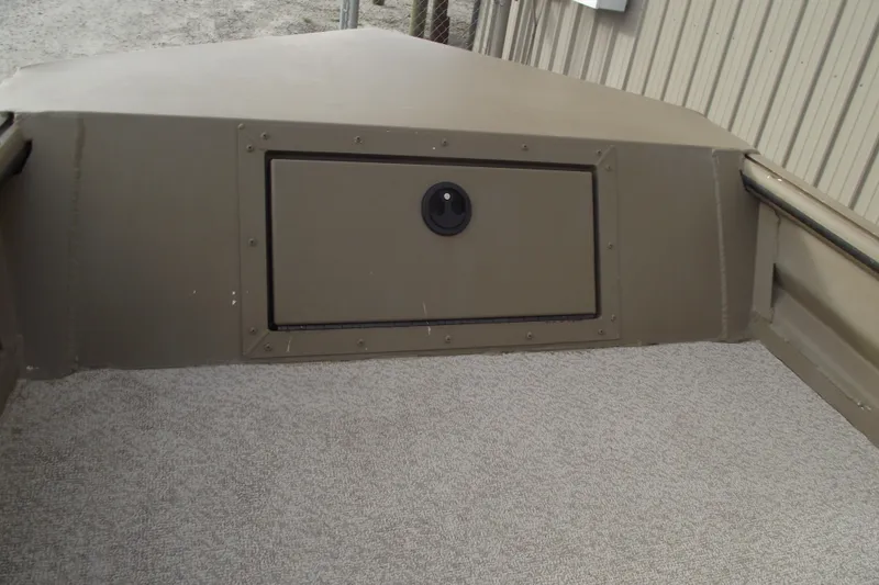 Slide: The Image of 2022 SeaArk DXS 1548 DKLD boat interior with storage compartment and nonskid floor. - 5