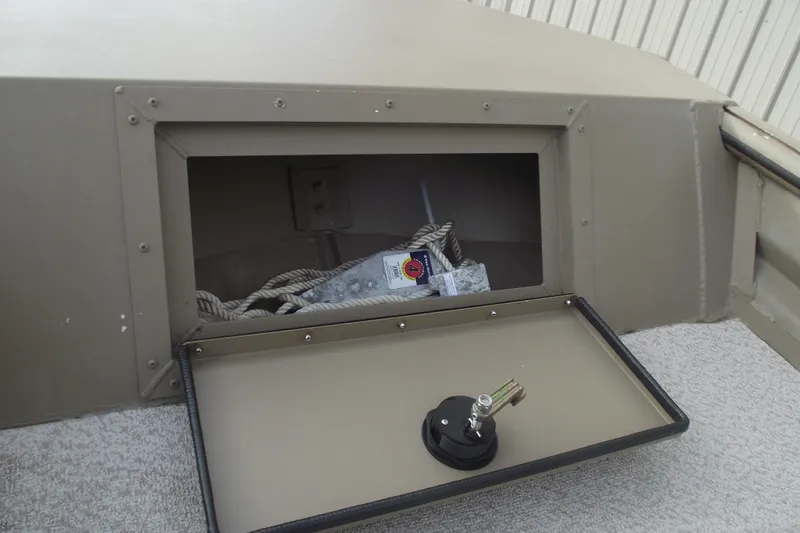 Slide: The Image of 2022 SeaArk DXS 1548 DKLD storage compartment with rope and accessories. - 6