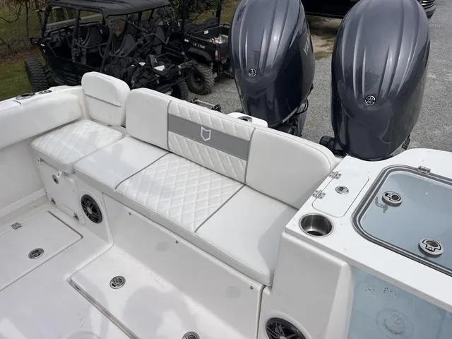 Slide: The Image of 2025 Sea Fox 268 Commander boat with dual engines and cushioned seating. - 15