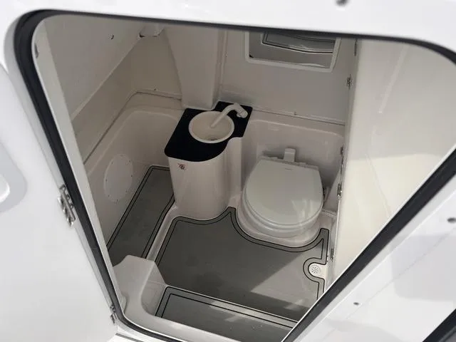 Slide: The Image of 2025 Sea Fox 268 Commander boat bathroom interior with toilet and sink. - 16