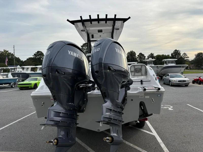 Slide: The Image of 2025 Sea Fox 268 Commander boat with dual Yamaha engines in a parking lot. - 5