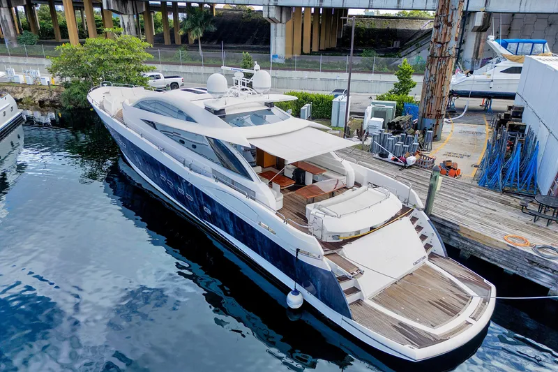 Slide: The Image of Luxurious 2007 Sunseeker Predator 108 yacht docked at marina, showcasing sleek design. - 0