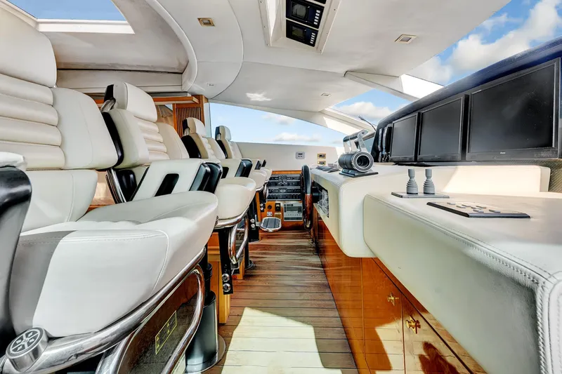 Slide: The Image of Luxurious interior of 2007 Sunseeker Predator 108 yacht with plush seating and modern controls. - 13
