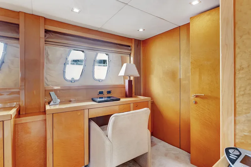 Slide: The Image of Luxurious interior of 2007 Sunseeker Predator 108 yacht with elegant wood finish and desk area. - 20