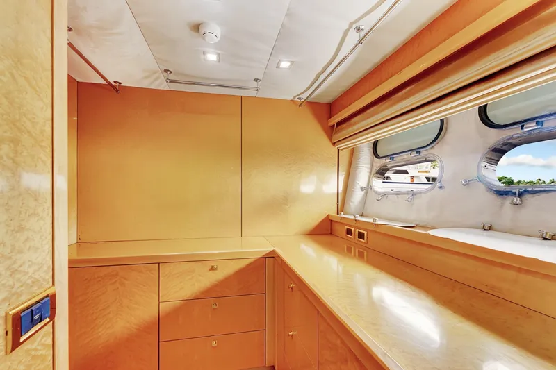 Slide: The Image of Luxurious interior of 2007 Sunseeker Predator 108 yacht with sleek wood finish and porthole windows. - 21