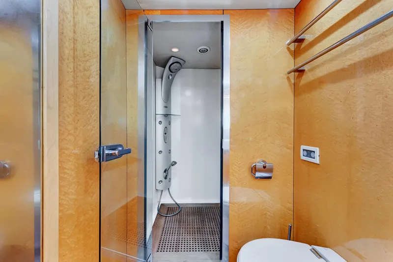 Slide: The Image of Luxurious bathroom on 2007 Sunseeker Predator 108 yacht with modern shower and wooden accents. - 22