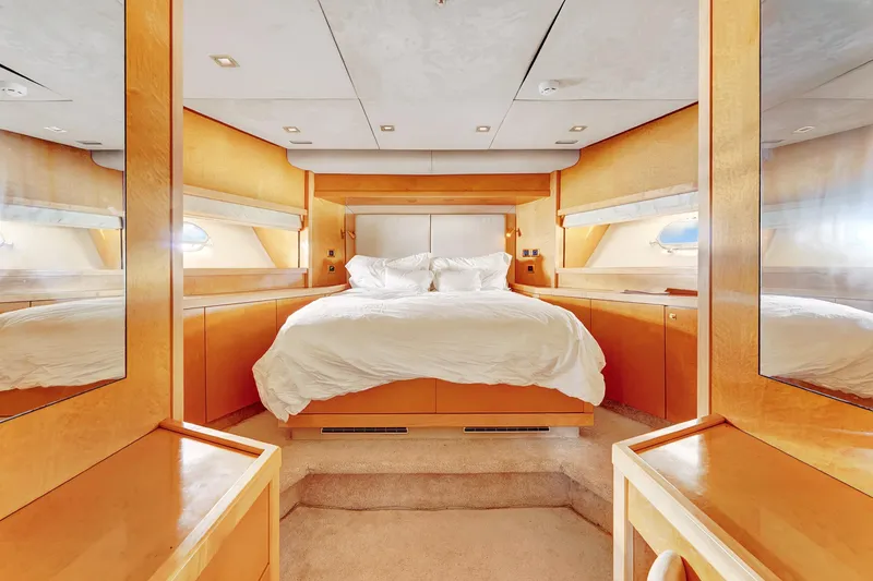 Slide: The Image of Luxurious bedroom interior on 2007 Sunseeker Predator 108 yacht, featuring elegant wood finishes. - 27
