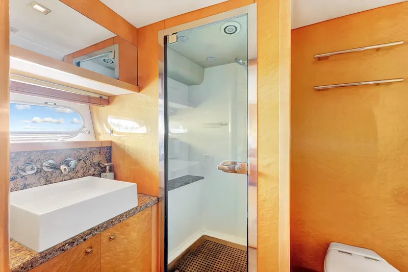 Slide: The Image of Luxurious bathroom in 2007 Sunseeker Predator 108 yacht with modern fixtures and glass shower. - 28
