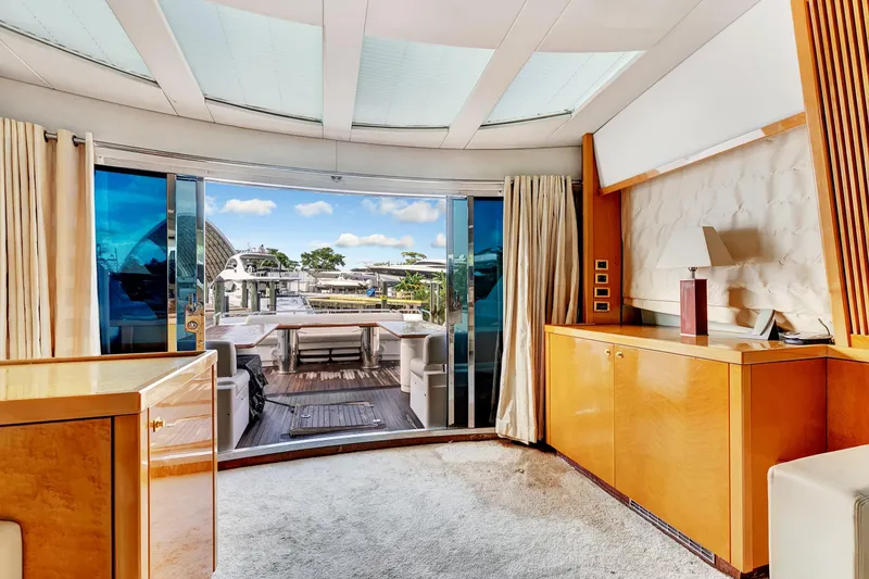 Slide: The Image of Luxurious interior of 2007 Sunseeker Predator 108 yacht with elegant wood finishes and marina view. - 33