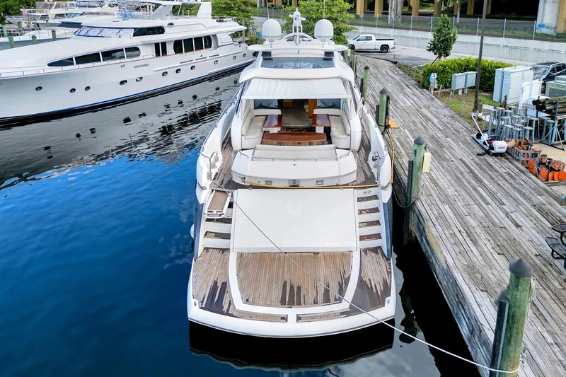 Slide: The Image of Sunseeker Predator 108 yacht, 2007 model, docked at marina with wooden deck. - 4