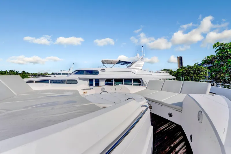 Slide: The Image of 2007 Sunseeker Predator 108 yacht with sleek design and spacious deck under blue sky. - 41