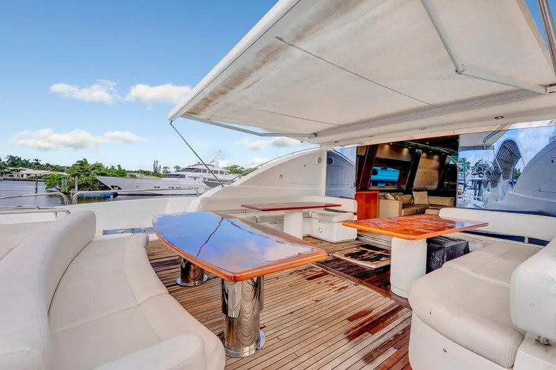 Slide: The Image of Luxurious 2007 Sunseeker Predator 108 yacht with spacious outdoor seating and polished wooden tables. - 42