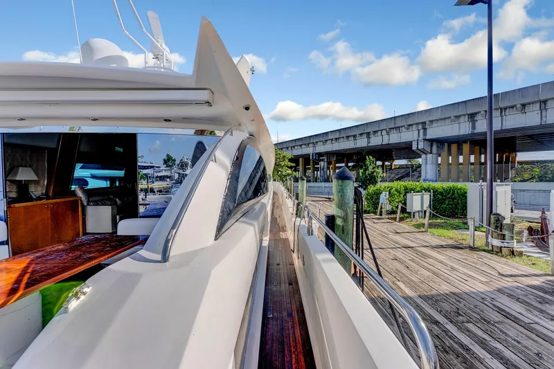 Slide: The Image of 2007 Sunseeker Predator 108 yacht docked, showcasing sleek design and luxurious interior. - 44
