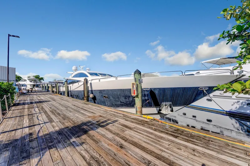 Slide: The Image of 2007 Sunseeker Predator 108 yacht docked at a sunny marina with clear skies. - 47