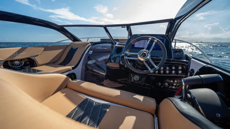 Slide: The Image of Luxurious 2025 Hanover 305 Inboard boat interior with sleek design and modern controls. - 7