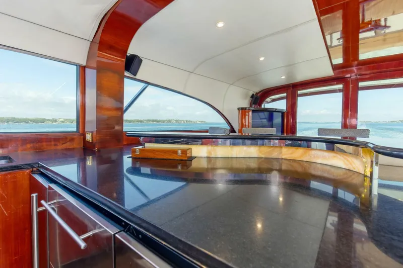 Slide: The Image of Luxurious interior of 2004 Custom Ebony Sportfish 65' CNV yacht with sleek design and ocean view. - 10