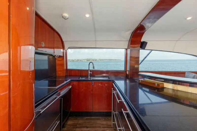 Slide: The Image of Luxurious kitchen interior of 2004 Custom Ebony Sportfish 65' CNV yacht with ocean view. - 11