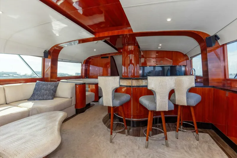 Slide: The Image of Luxurious interior of 2004 Custom Ebony Sportfish 65' CNV yacht with elegant wood finishes. - 13