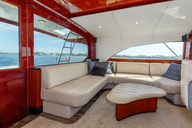 Slide: The Image of Luxurious interior of 2004 Custom Ebony Sportfish 65' CNV yacht with elegant seating. - 15
