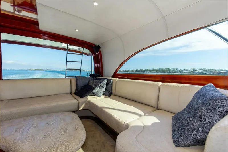 Slide: The Image of Luxurious interior of 2004 Custom Ebony Sportfish 65' CNV yacht with plush seating and ocean view. - 16