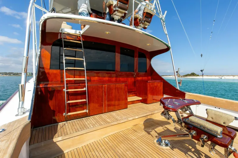 Slide: The Image of Luxurious 2004 Custom Ebony Sportfish 65' CNV yacht with wooden deck and fishing chair. - 2