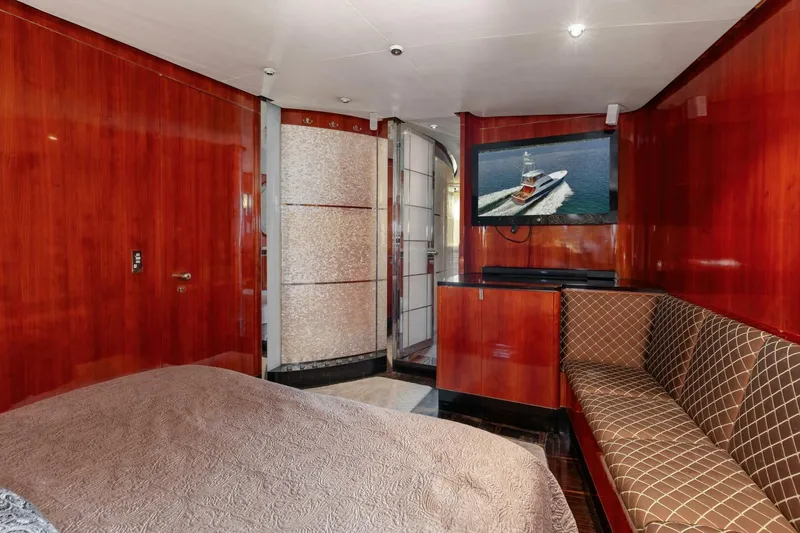Slide: The Image of Luxurious cabin interior of 2004 Custom Ebony Sportfish 65' CNV yacht with TV and seating. - 22
