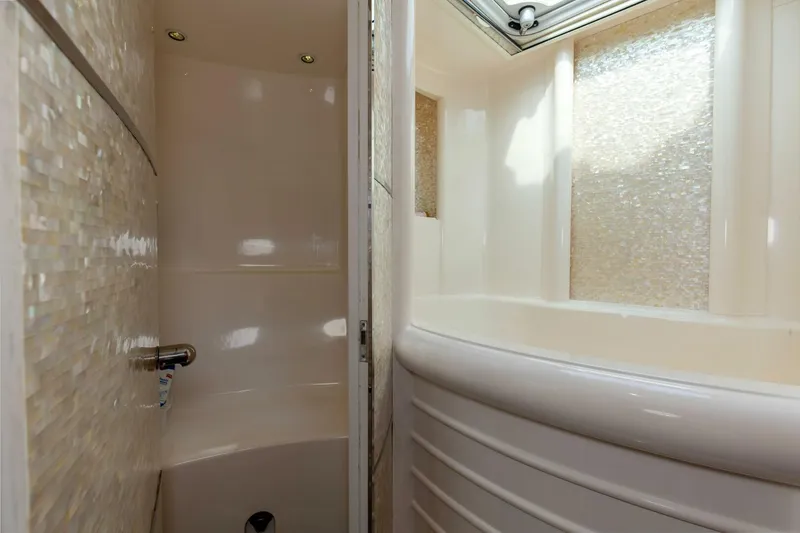 Slide: The Image of Luxurious bathroom interior on 2004 Custom Ebony Sportfish 65' CNV yacht. - 26