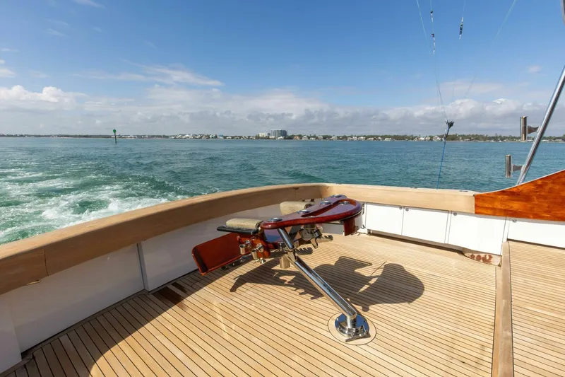 Slide: The Image of Custom Ebony Sportfish 65' CNV 2004 yacht deck with ocean view and fishing chair. - 35