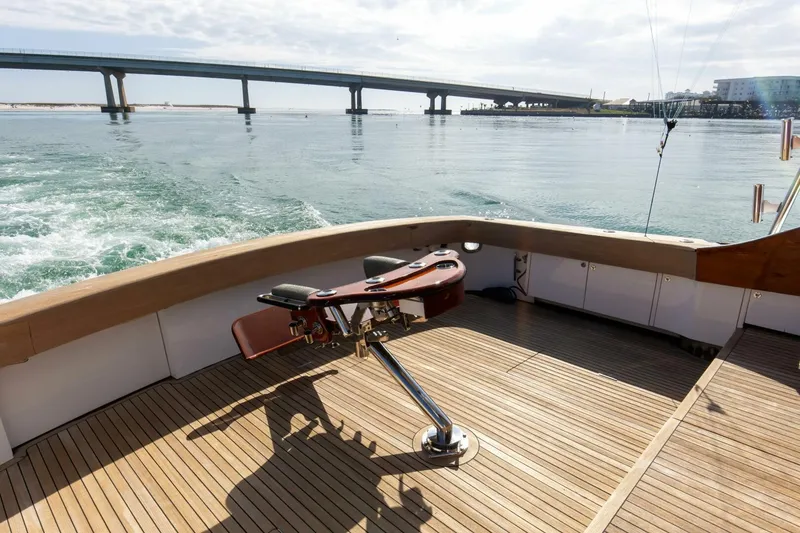 Slide: The Image of Custom Ebony Sportfish 65' CNV 2004 boat deck with scenic bridge view. - 37