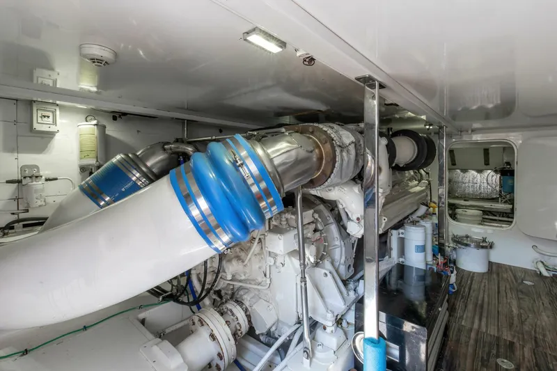 Slide: The Image of Engine room of 2004 Custom Ebony Sportfish 65' CNV yacht, showcasing machinery and components. - 43