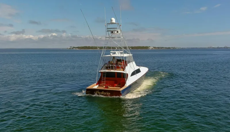 Slide: The Image of Custom Ebony Sportfish 65' CNV yacht cruising on open water, 2004 model. - 51