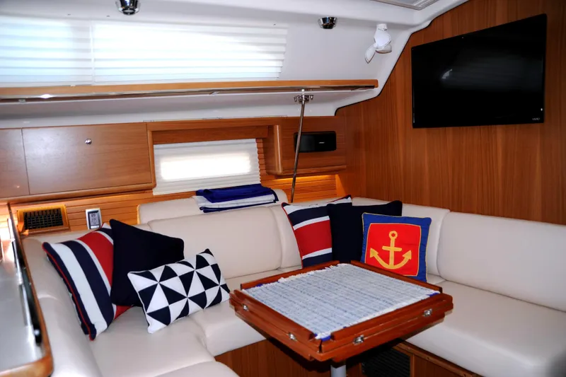 Slide: The Image of Interior of 2016 Catalina 445 yacht with nautical-themed cushions and modern decor. - 12