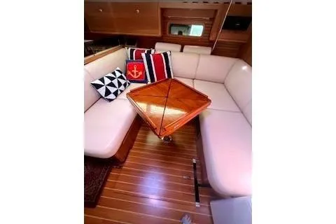 Slide: The Image of 2016 Catalina 445 yacht interior with plush seating and decorative pillows. - 14