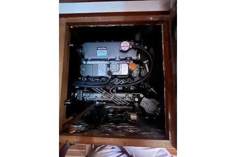 Slide: The Image of Engine compartment of a 2016 Catalina 445 sailboat, showcasing mechanical components. - 22