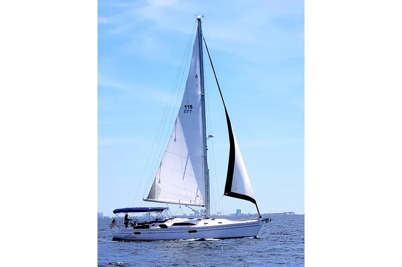 Slide: The Image of 2016 Catalina 445 sailboat cruising on open water under clear blue skies. - 3