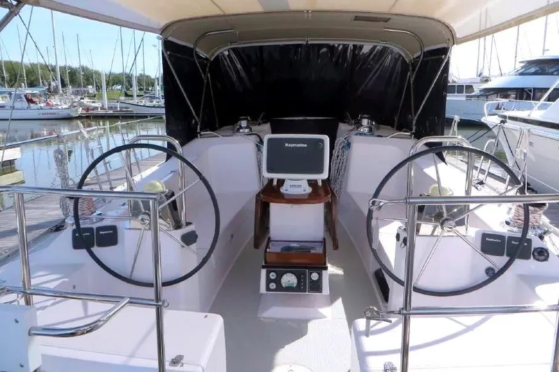 Slide: The Image of 2016 Catalina 445 yacht cockpit with dual steering wheels and navigation equipment. - 4