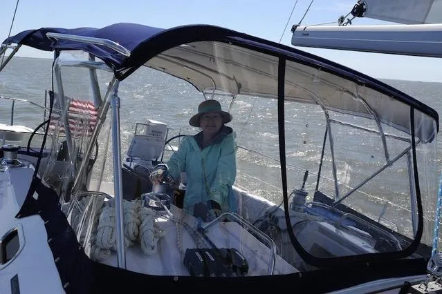 Slide: The Image of Person sailing a 2016 Catalina 445 boat on a sunny day. - 5